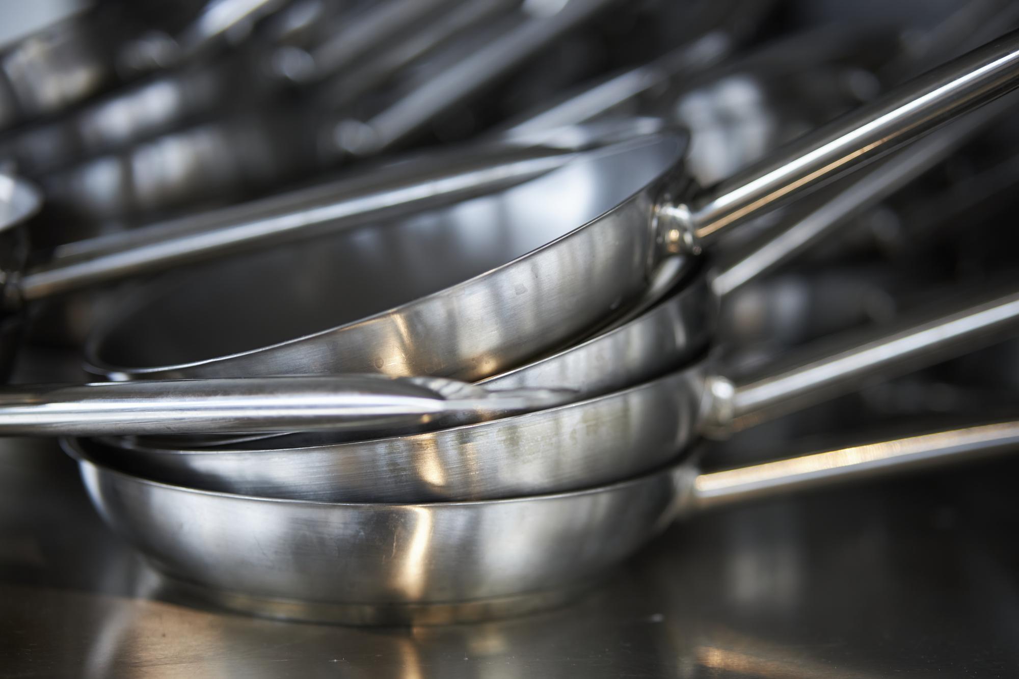 Clean professional kitchen workspace with utensils
