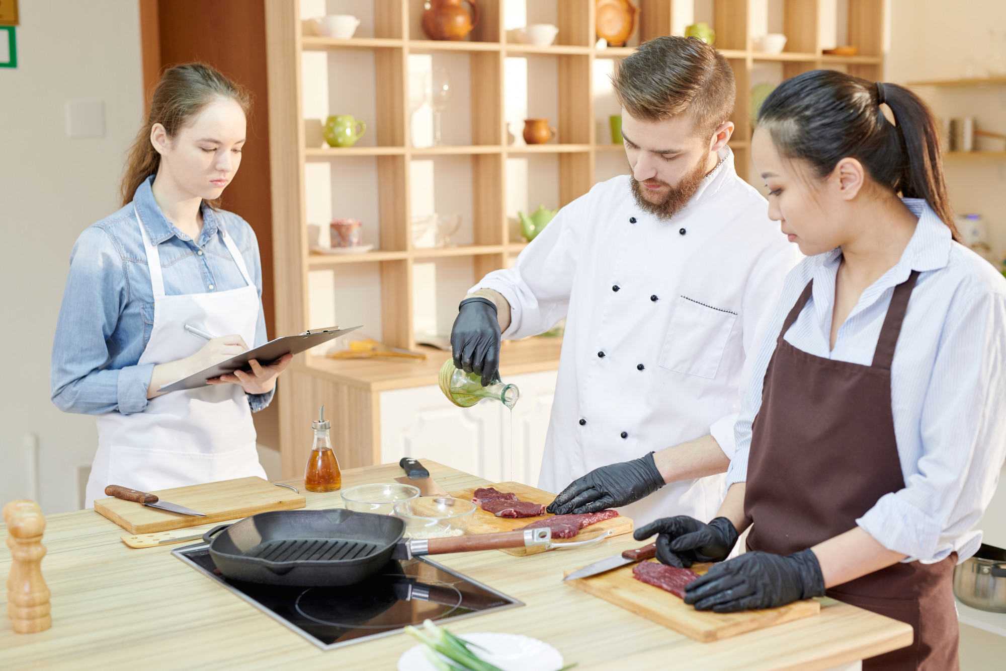Small team preparing ingredients in uniform